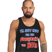 Man wearing "I'm Just Here for the Fireworks and Beer" tank top in black, showcasing comfortable cotton fabric.
