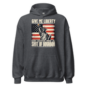 Hoodie with Give Me Liberty or Give Me a Shot of Bourbon text, Statue of Liberty holding a shot glass, and distressed American flag background. Perfect for 4th of July.