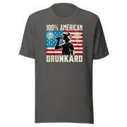 4th of July T-shirt with '100% American Drunkard' text, man drinking a bottle of beer wearing a trucker hat, and distressed American flag background