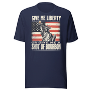 T-shirt with Give Me Liberty or Give Me a Shot of Bourbon text, Statue of Liberty holding a shot glass, and distressed American flag background. Perfect for 4th of July.
