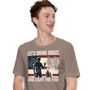 4th of July T-shirt with 'Let's Drink Booze and Light the Fuse' text, featuring a festive, patriotic theme