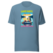 Tee with "Lake Days Are Made for Sipping and Dipping," featuring a woman on a tube float with a cocktail, lake and sunset backdrop.