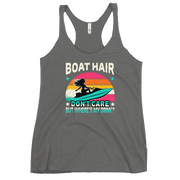 Racerback tank with "Boar Hair Don't Care, But Where's My Drink?" featuring a woman on a jet ski against a sunset.