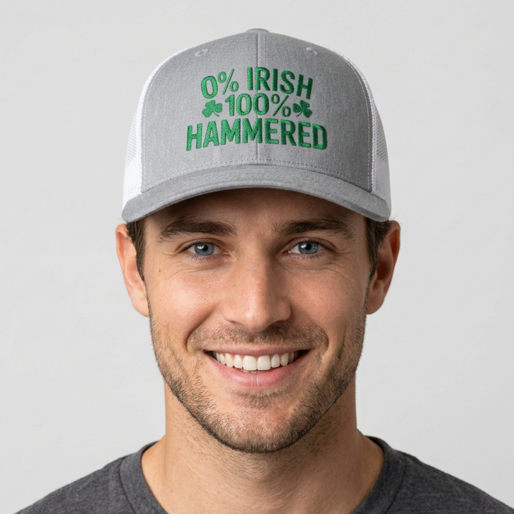 Man wearing a gray and white curved trucker hat with the phrase '0% Irish 100% HAMMERED' funny St Patricks Day Pub crawl and Parade design