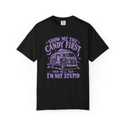 A black short-sleeve crewneck t-shirt with a purple graphic print on the front. The graphic features a retro VW bus and the text 'SHOW ME THE CANDY FIRST THEN WE'LL TALK I'M NOT STUPID'.