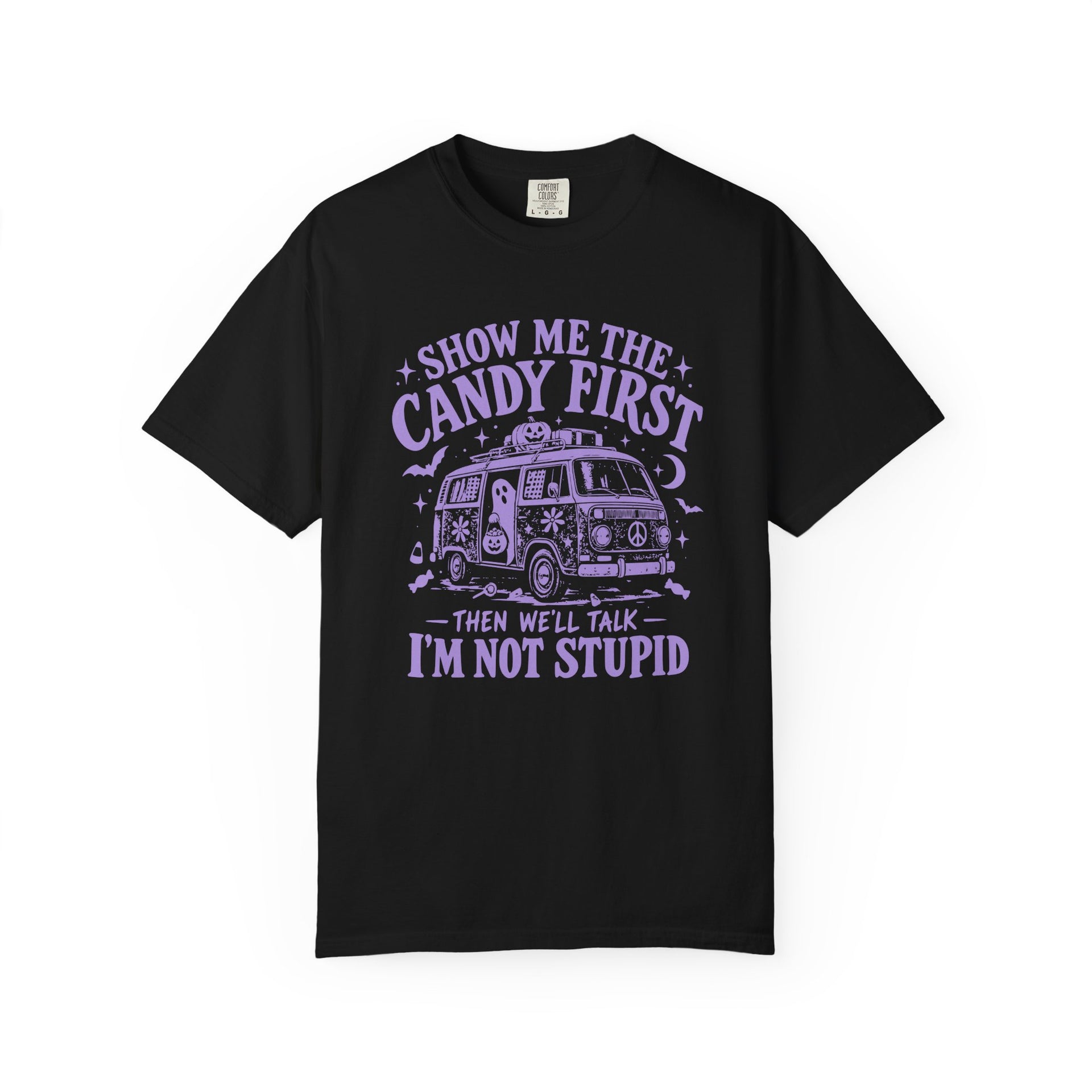 A black short-sleeve crewneck t-shirt with a purple graphic print on the front. The graphic features a retro VW bus and the text 'SHOW ME THE CANDY FIRST THEN WE'LL TALK I'M NOT STUPID'.