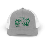 a gray and white curved trucker hat with the phrase 'Fueled by Irish Whiskey' funny St Patricks Day Pub crawl and parade design