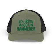 A green and black curved trucker hat with the phrase '0% Irish 100% HAMMERED' funny St Patricks Day Pub crawl and Parade design
