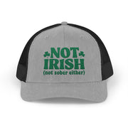 a gray and black curved bill trucker hat with 'Not Irish (not either other)' text funny St Patricks Day pub crawl design