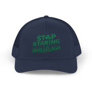 a navy curved trucker hat with the phrase "Stop Staring at my Shillelagh" funny St Patricks Day pub crawl or parade design