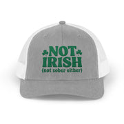 a gray and white curved bill trucker hat with 'Not Irish (not either other)' text funny St Patricks Day pub crawl design