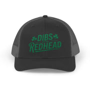 black and gray curved bill trucker hat with the text 'DIBS on the REDHEAD' funny st patricks day pub crawl design