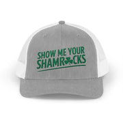 a gray and white curved trucker hat with 'Show Me Your Shamrocks' text funny st patricks day pub crawl design