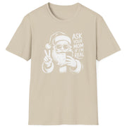 Funny Christmas Humor Short Sleeve Shirt with Santa making the peace sign and holding a phone taking a selfie and the text "Ask Your Mom If I'm Real" - Sand
