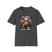 a dark heather gray  tshirt with a meme of kim jong un on the phone with donald trump and the phrase "Hey Donald, We Cool... Right?" funny political statement shirt