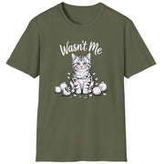 Funny Christmas Cat Humor Short Sleeve Shirt with a cute cat wrapped in christmas lights and surrounded by broken ornaments and the text "Wasn't Me" - Military Green
