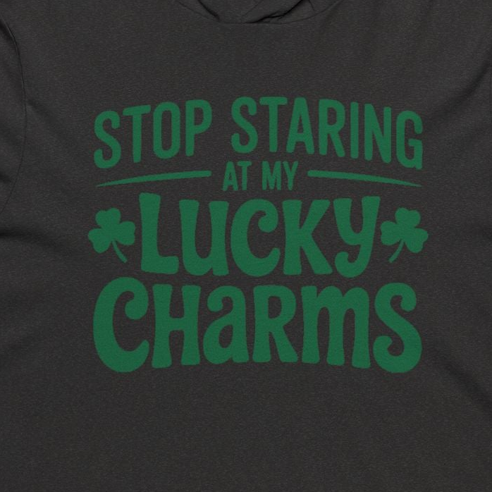 Dark gray hoodie with green text 'Stop Staring at My Lucky Charms' on a plain background