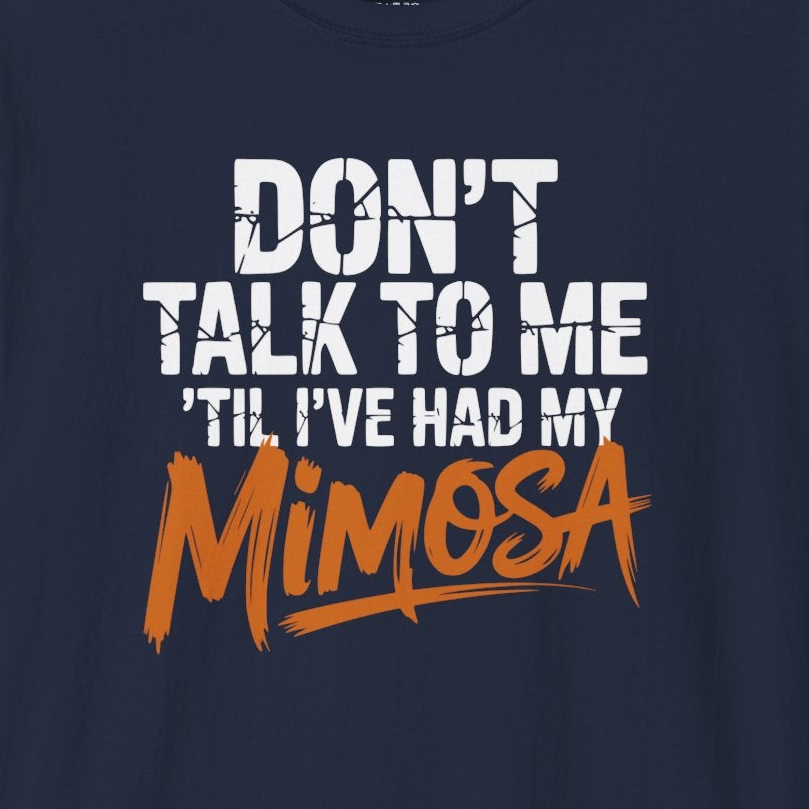 a navy blue premium soft-style t-shirt with text 'DON'T TALK TO ME TIL I'VE HAD MY MIMOSA' funny mom life, mother's day design
