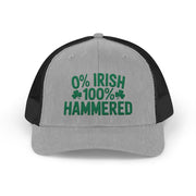 A gray and black curved trucker hat with the phrase '0% Irish 100% HAMMERED' funny St Patricks Day Pub crawl and Parade design