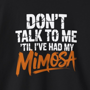 a black sweatshirt with the text 'Don't talk to me 'til i've had my mimosa' funny mothers day, girls trip, mom life design