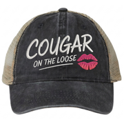 a balck and khaki faded ponytail trucker cap with 'Cougar on the Loose' text and lipstick kiss mark funny spring break, beach vacation, summer vacation, lake season design.