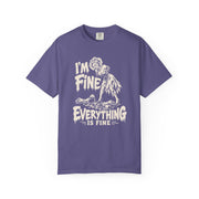 A purple short-sleeve crewneck t-shirt with a white graphic print on the front. The graphic features a zombie-like creature and the text 'I'M FINE' above and 'EVERYTHING IS FINE' below.