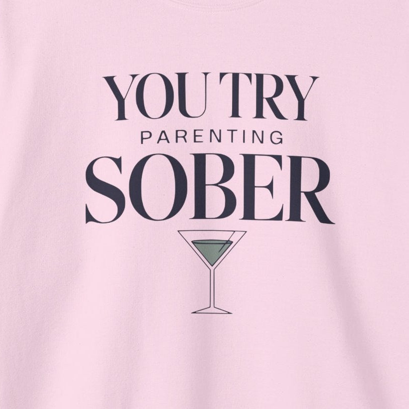 a pink sweatshirt with the text 'You try parenting sober' funny mother's day, mom life, girls trips, beach trip design