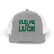 a gray and white curved bill trucker hat with 'Rub Me for Luck' text funny st patricks day pub crawl design