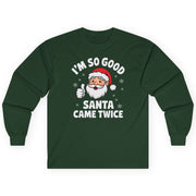 Green long-sleeve shirt with Santa Claus graphic and text on a white background