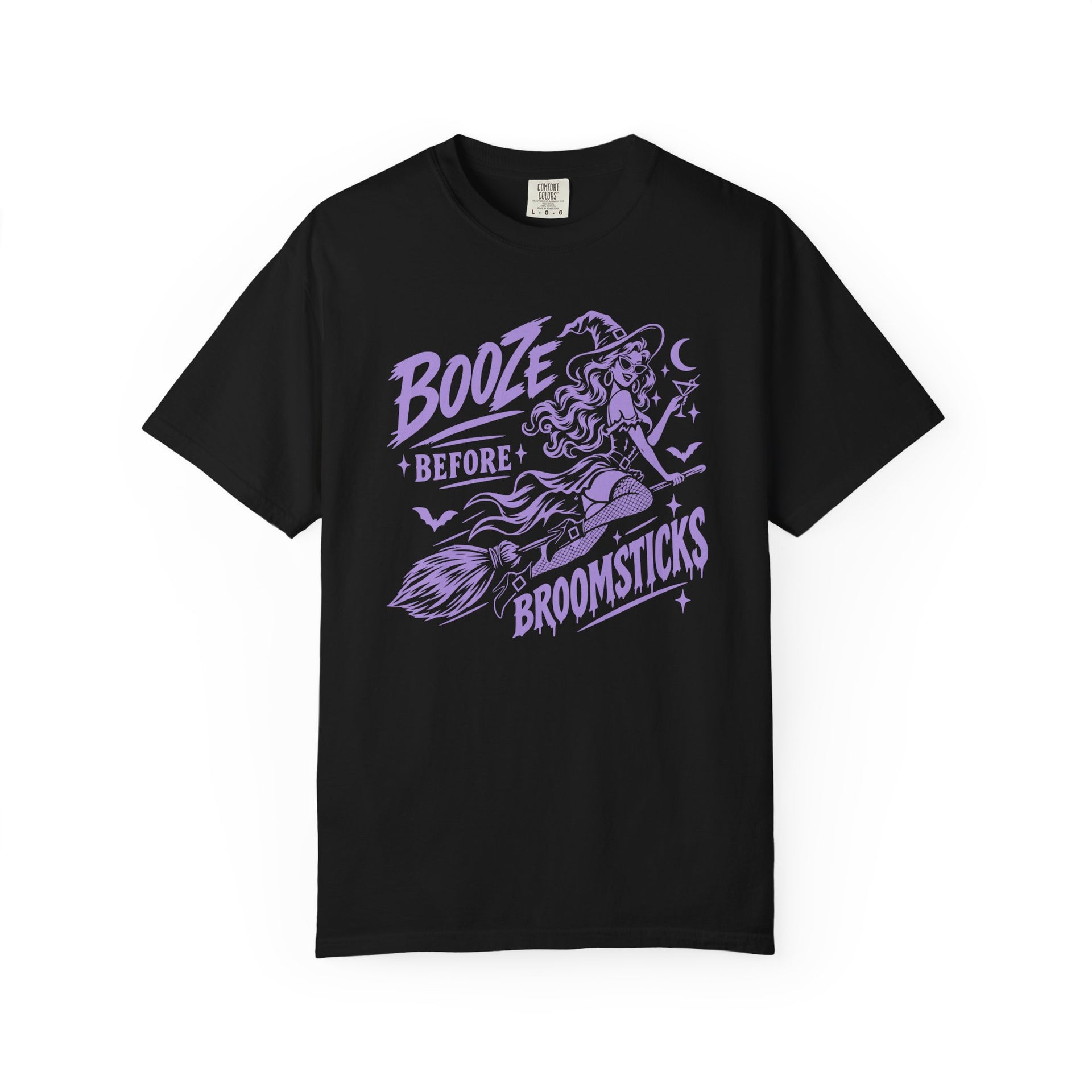 A black short-sleeve crewneck t-shirt with a purple graphic of a witch riding a broomstick, accompanied by the text 'BOOZE BEFORE BROOMSTICKS'.