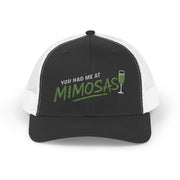 a black and white curved bill trucker hat with the phrase'You Had Me at Mimosas' text funny Spring break, girls trip, guys trip, beach trip, summer vacation, lake season design
