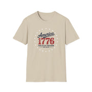 Beige t-shirt with 'America 1776 fueled by freedom (and beer)' text on a white background