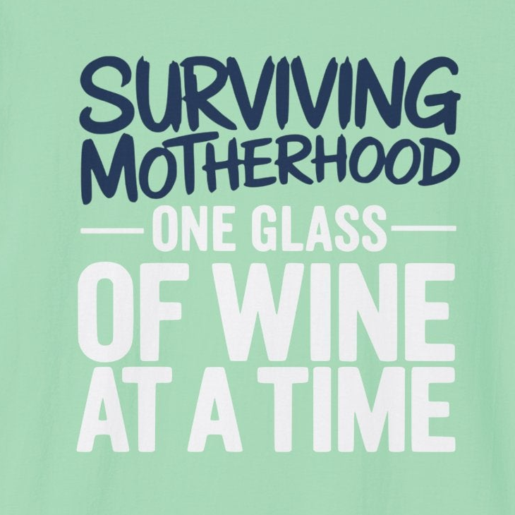 a light green t-shirt with the phrase 'Surviving Motherhood One Glass of Wine at a Time' funny Mother's day, beach vacation, spring break design