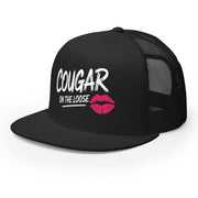 a black flat bill trucker hat with the phrase 'Cougar on the Loose' funny beach trip, girls trip, bachelorette party, or spring break design