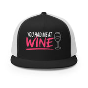 Black and white flat bill trucker hat with 'You Had Me at Wine' text and wine glass graphic funny spring break hat