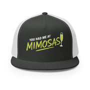 Charcoal and white flat bill trucker cap with 'You Had Me at Mimosas' text and champagne glass for Spring Break, Girls Trips, or Bachelorette Parties