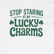  white long-sleeve shirt with the phrase stop staring at my lucky charms funny st patricks day design