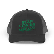 a black and gray curved trucker hat with the phrase "Stop Staring at my Shillelagh" funny St Patricks Day pub crawl or parade design