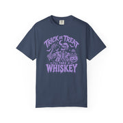 A navy blue short-sleeve crewneck t-shirt with a purple Halloween graphic on the chest featuring a skeleton, pumpkins, and the text 'TRICK OR TREAT - I'LL TAKE A WHISKEY'.