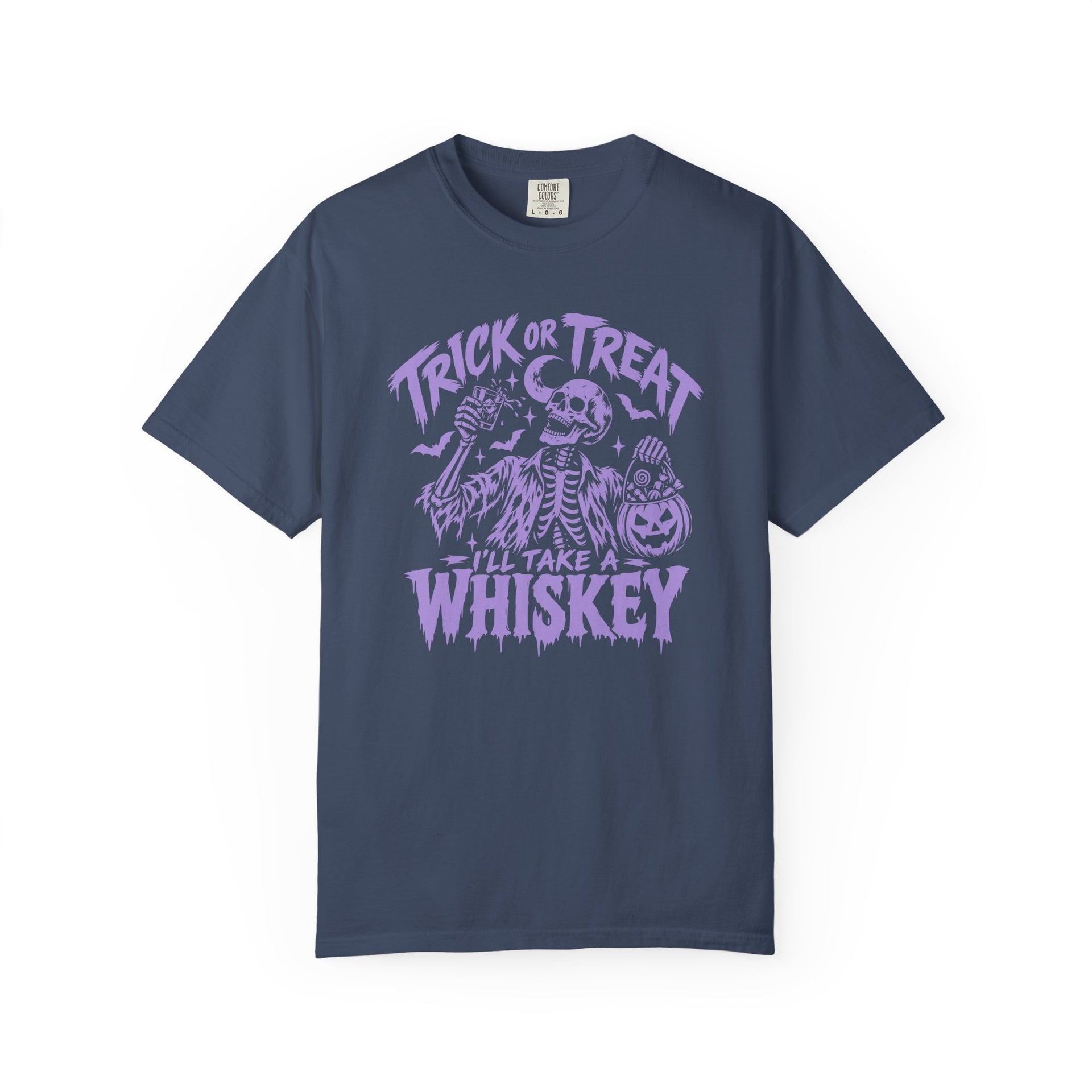 A navy blue short-sleeve crewneck t-shirt with a purple Halloween graphic on the chest featuring a skeleton, pumpkins, and the text 'TRICK OR TREAT - I'LL TAKE A WHISKEY'.