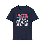 a navy t-shirt with the phrase 'Surviving Motherhood One Glass of Wine at a Time' funny Mother's day, beach vacation, spring break design