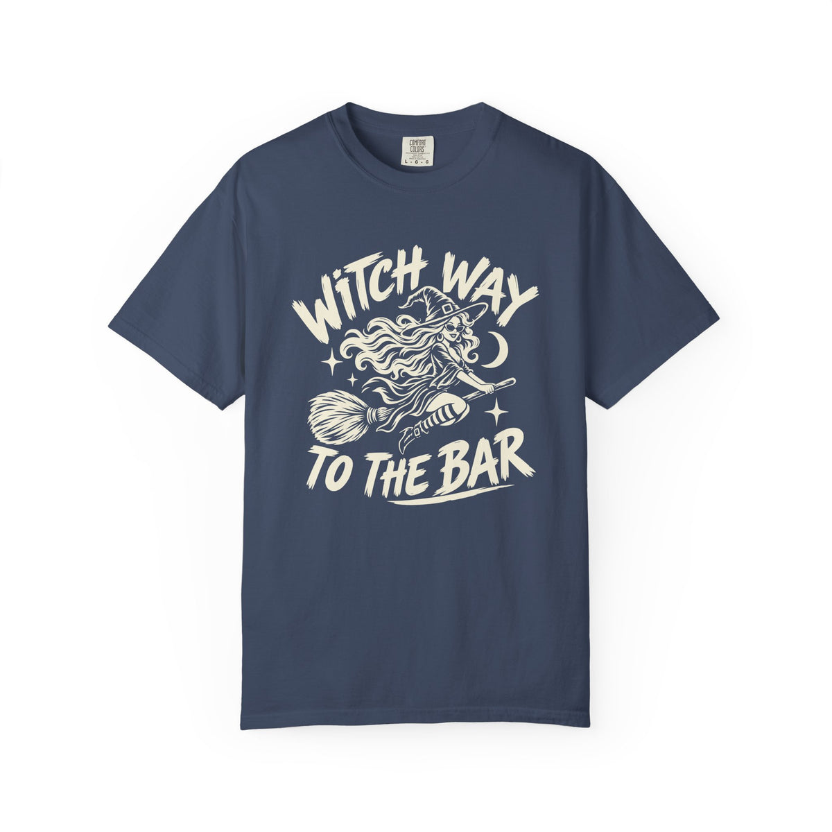 A navy blue short-sleeve crewneck t-shirt with a cream-colored graphic on the front showing a witch riding a broomstick with the text 'WITCH WAY TO THE BAR'.