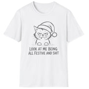 Funny Christmas Humor Short Sleeve Shirt with a grumpy cat wearing a santa hat and the text "Look at me being all Festive and Shit" - White