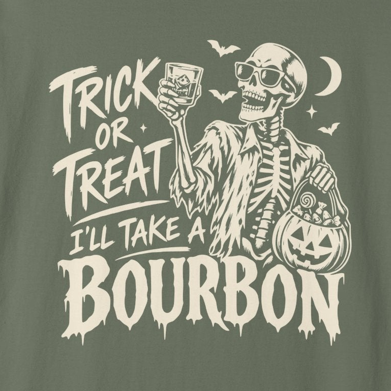 A close-up of a dark olive green graphic print featuring a skeleton wearing sunglasses, holding a glass of bourbon and a pumpkin bucket of candy, with the text 'TRICK OR TREAT I'LL TAKE A BOURBON'.