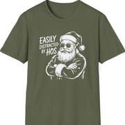 Funny Christmas Humor Short Sleeve Shirt with santa arms corssed and the text and the text "Easily Distracted By Hos" - Military Green