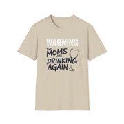 a beige t-shirt with the text 'Warning:the moms are drinking again' funny mother's day, beach trip, girls trip design