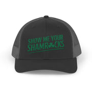 a black and gray curved trucker hat with 'Show Me Your Shamrocks' text funny st patricks day pub crawl design