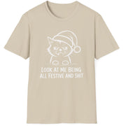 Funny Christmas Humor Short Sleeve Shirt with a grumpy cat wearing a santa hat and the text "Look at me being all Festive and Shit" - Sand