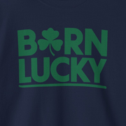 navy blue sweatshirt with 'Born Lucky' text and green clover funny st patricks design