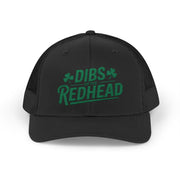 black curved bill trucker hat with the text 'DIBS on the REDHEAD' funny st patricks day pub crawl design